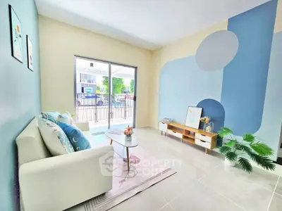 Bright and modern living room with stylish decor and large window view.