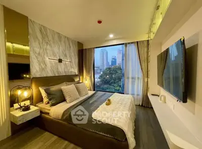 Luxurious bedroom with city view, modern decor, and large TV in upscale apartment.