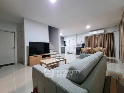 Spacious modern living room with sleek furniture and open layout