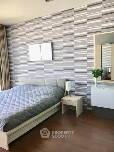 Modern bedroom with stylish decor and natural light
