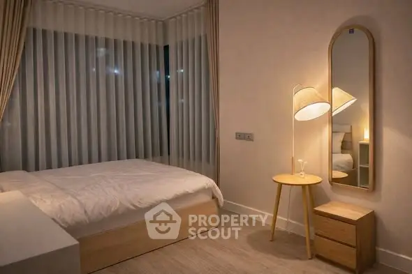 Cozy modern bedroom with stylish lighting and minimalist decor