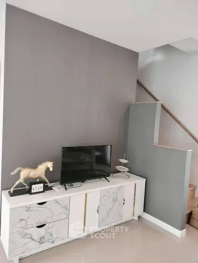 Modern living room with stylish TV stand and decorative elements