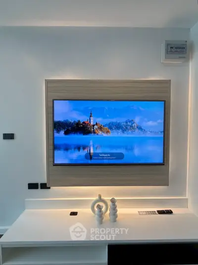 Modern living room with wall-mounted TV and stylish decor