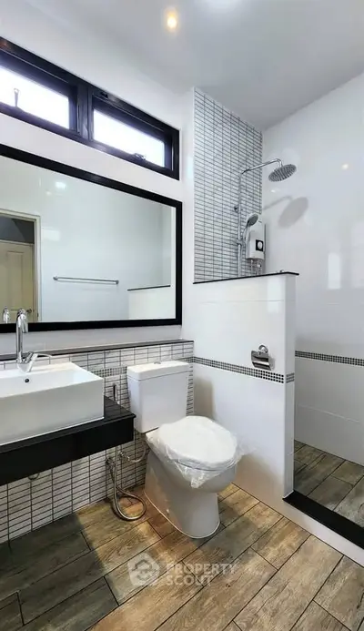 Modern bathroom with sleek design and spacious shower area