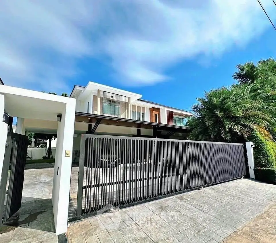 Luxurious modern house with sleek design and spacious driveway, perfect for upscale living.