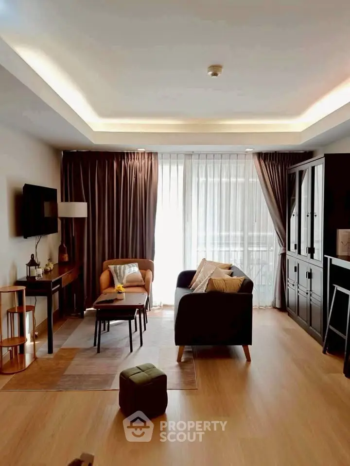 Spacious living room with modern decor and natural light