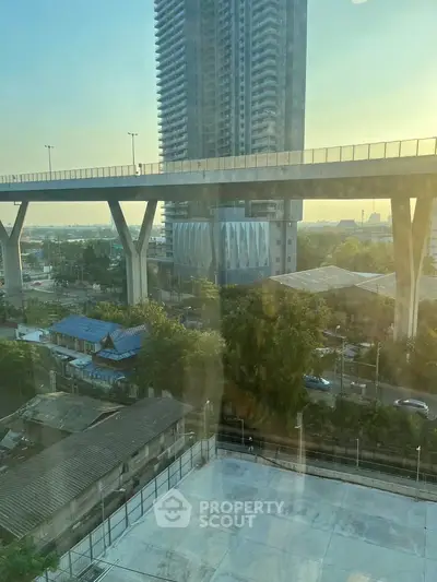 Stunning urban view from high-rise building with modern architecture and expansive cityscape.