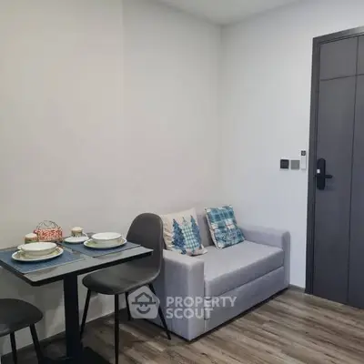 Cozy modern living room with compact dining area and stylish decor