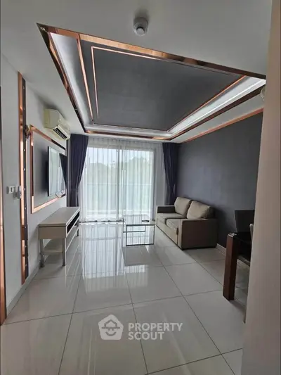 Modern living room with sleek design, large window, and stylish ceiling accents.