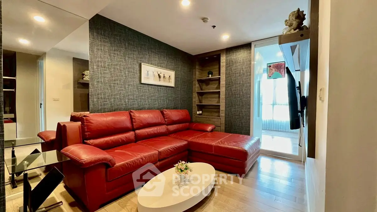 Stylish living room with red leather sectional sofa and modern decor