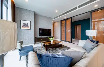 Luxurious modern living room with stylish decor and large windows offering natural light.