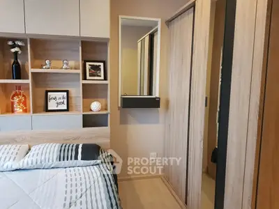 Modern bedroom with stylish decor and built-in storage solutions.