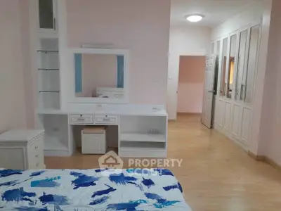 Spacious bedroom with built-in wardrobe and modern decor