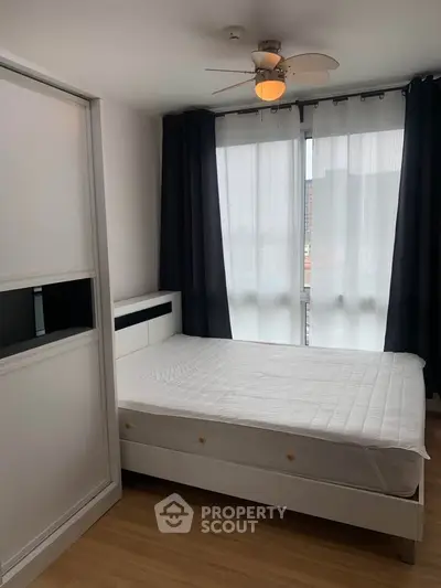 Modern bedroom with sleek design and ample natural light