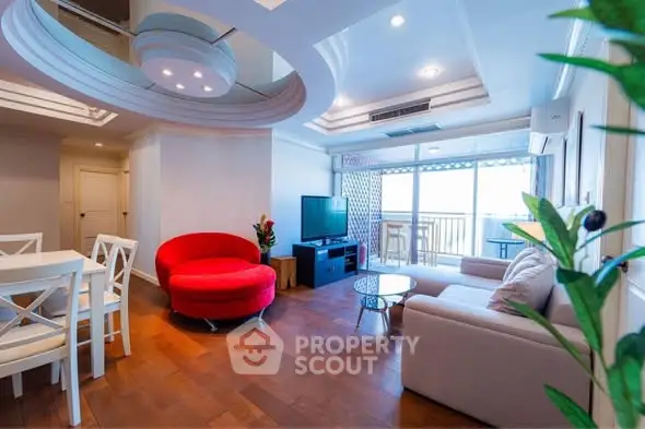 Spacious living room with modern furniture and balcony view