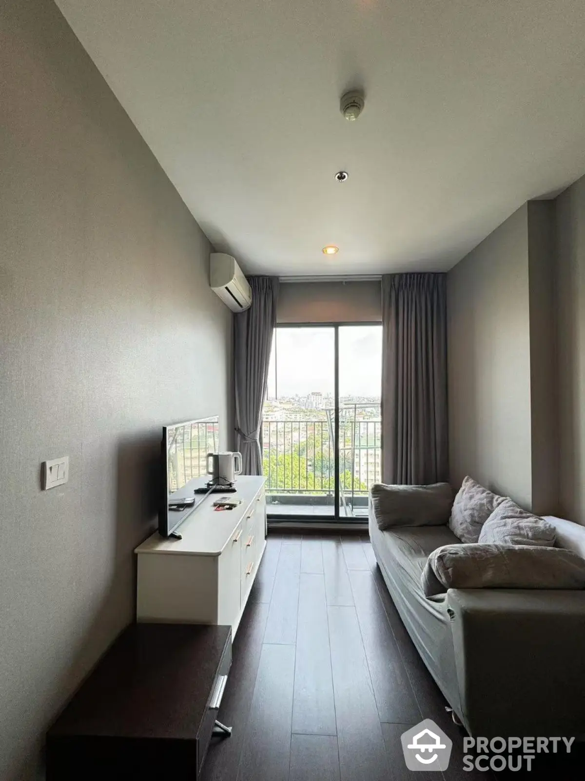 Modern living room with balcony view and sleek furniture