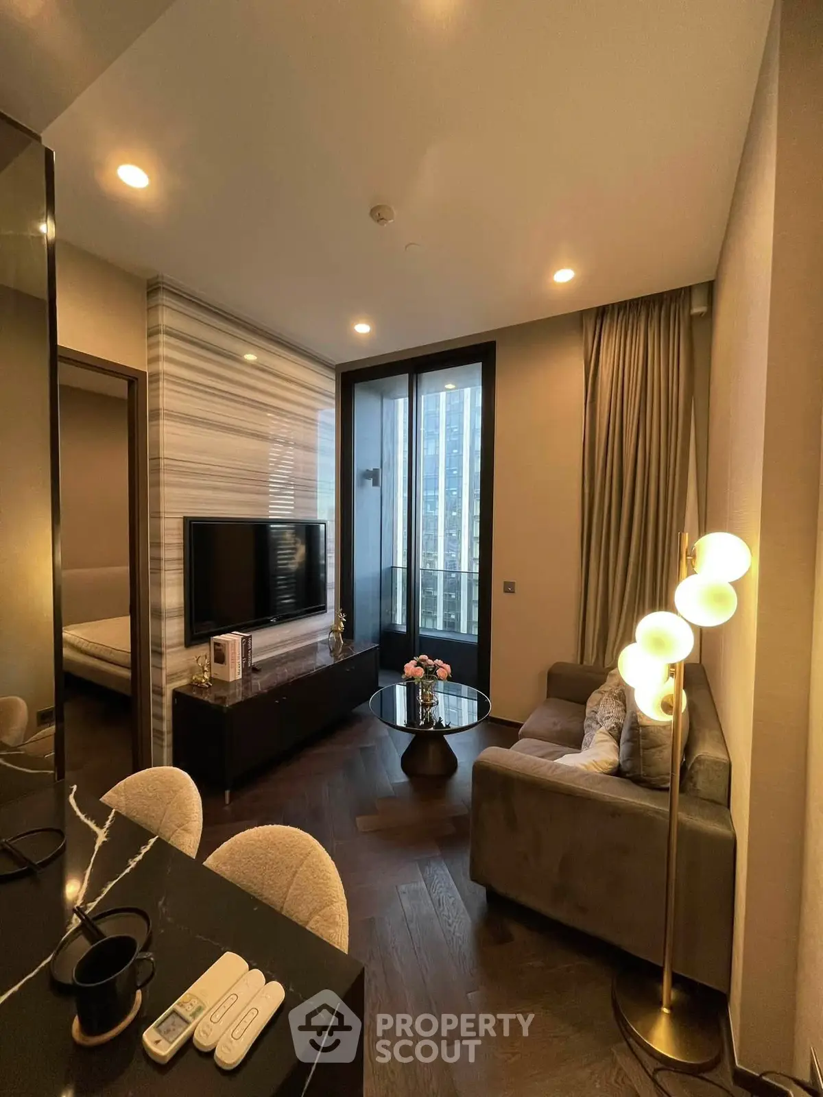 Modern living room with stylish decor and city view from large window