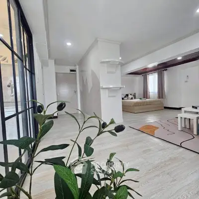 Spacious modern living room with stylish decor and natural light