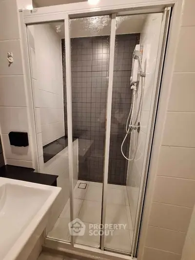 Modern bathroom with sleek shower enclosure and stylish tile design