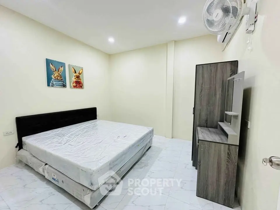 Spacious bedroom with modern furniture and stylish decor