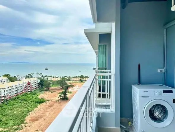 Stunning ocean view from a modern balcony with washing machine included.