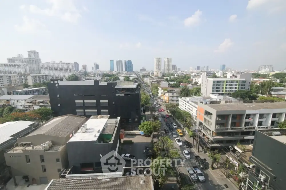 Stunning cityscape view from high-rise building showcasing urban skyline and bustling streets.