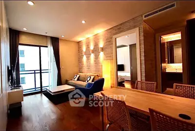 Modern living room with stylish decor and open layout, featuring a cozy seating area and dining space.