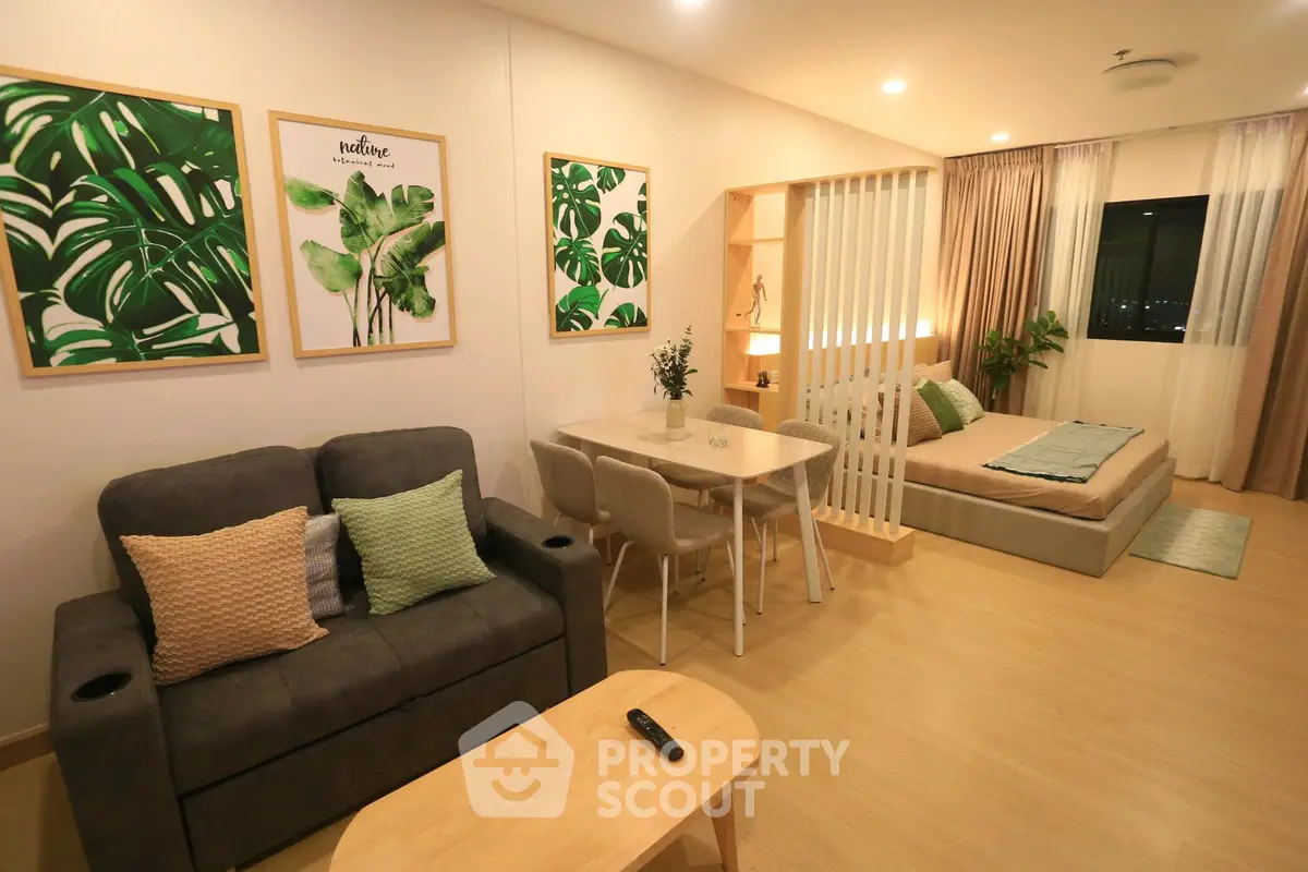 Modern studio apartment with cozy living area and stylish decor