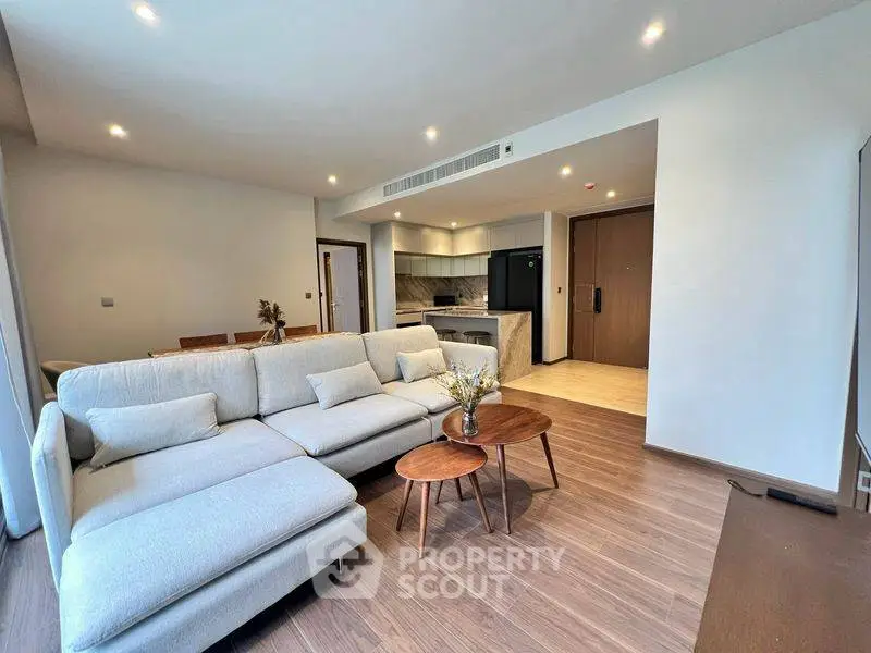 Spacious modern living room with open kitchen and elegant decor