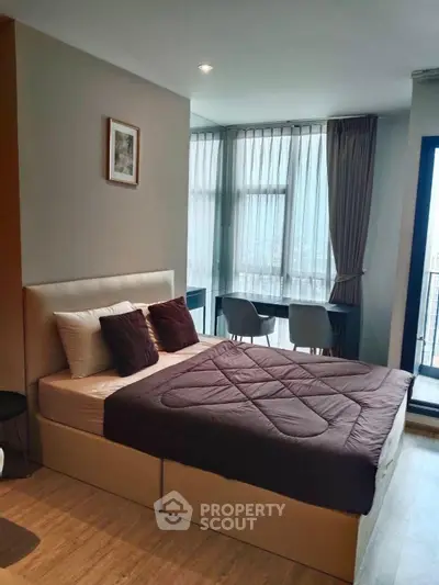 Modern bedroom with city view and stylish decor