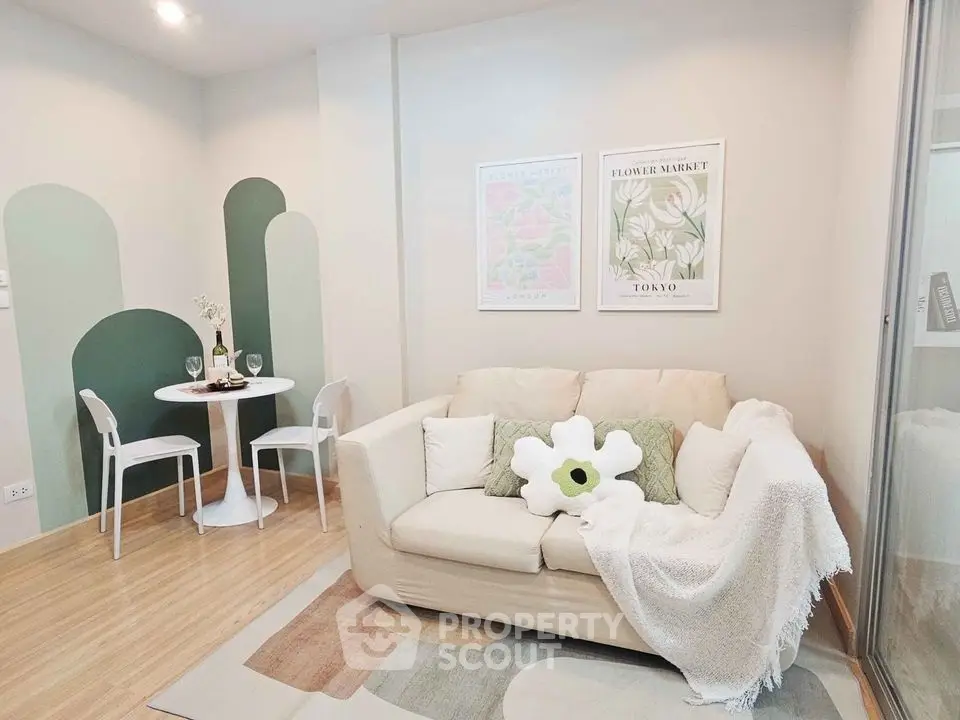 Charming living room with cozy sofa and stylish decor, perfect for relaxation and entertaining.