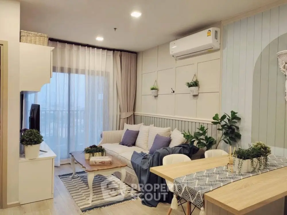 Chic modern living room with cozy decor and balcony view