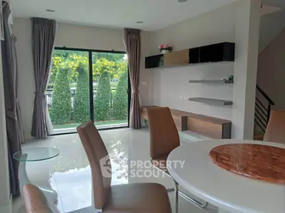 Spacious living room with modern furniture and garden view