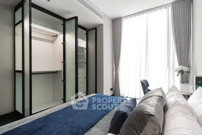 Modern bedroom with open walk-in closet and large window with curtains