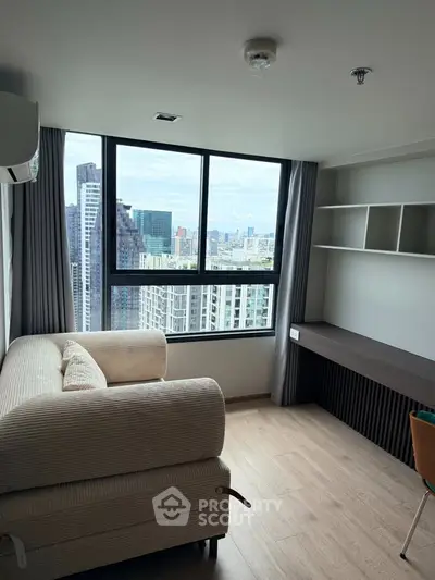 Modern high-rise apartment with stunning city view and cozy living area.