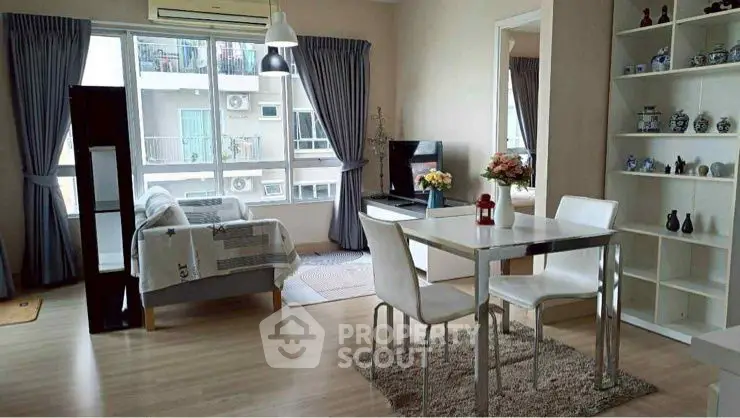 Modern living room with dining area and large window view