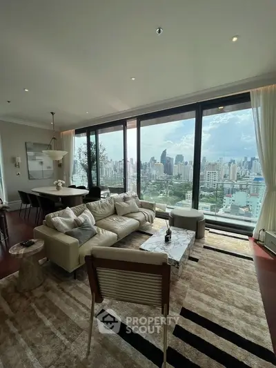 Luxurious living room with panoramic city view and elegant furnishings.
