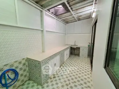 Charming rustic kitchen with patterned tiles and ample counter space