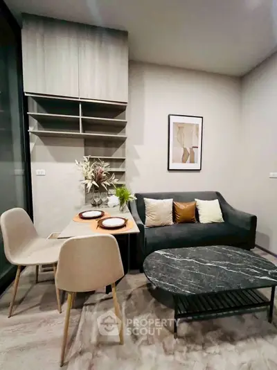 Modern living room with stylish decor and cozy dining area, perfect for urban living.