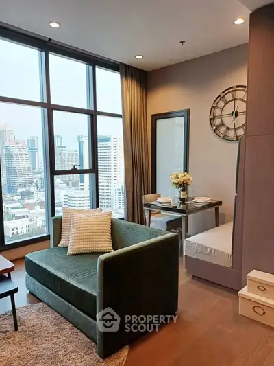 Modern living room with city view, featuring stylish furniture and elegant decor in a high-rise apartment.