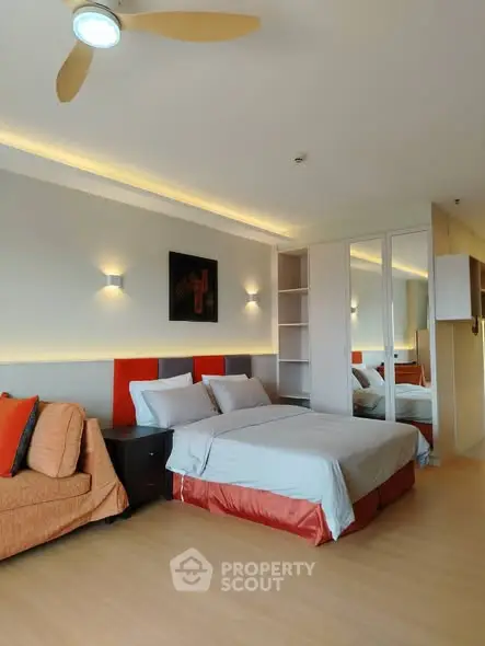 Modern bedroom with stylish decor and ample natural light