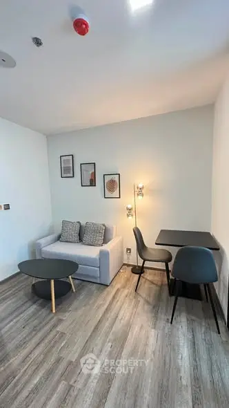 Modern living room with stylish decor and cozy seating area in a contemporary apartment.