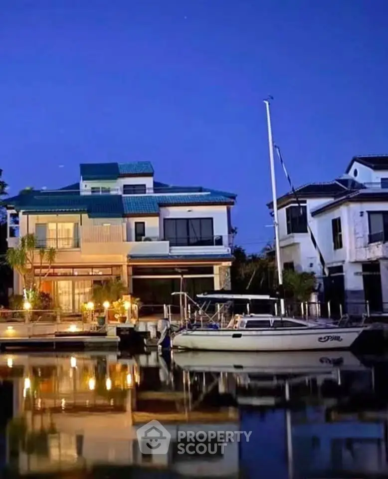 Luxurious waterfront villa with private dock and stunning night view