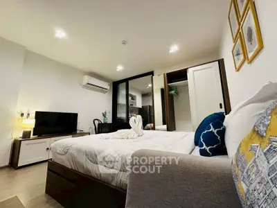Modern bedroom with stylish decor and open layout in a cozy apartment.