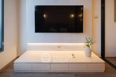 Modern living room with sleek TV setup and stylish decor