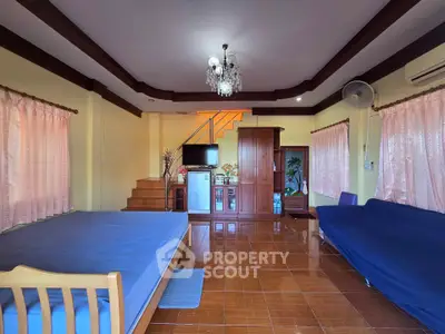Spacious living room with elegant chandelier and wooden accents
