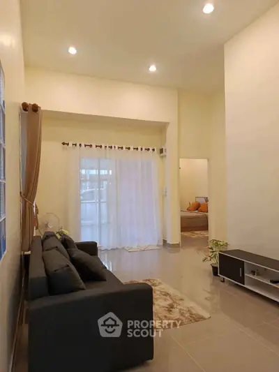 Spacious living room with modern decor and cozy ambiance