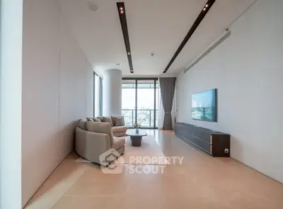 Spacious modern living room with panoramic city view and elegant furnishings.