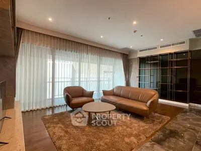 Luxurious living room with elegant leather furniture and floor-to-ceiling windows in a modern apartment.
