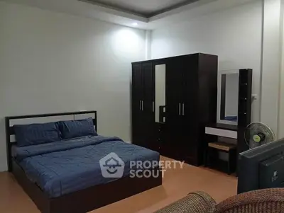 Spacious bedroom with modern furniture and cozy ambiance